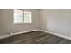 Bedroom featuring hardwood floors and a window at 5995 E Iliff-1 Ave # 309, Denver, CO 80222