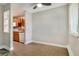 Bright dining area featuring wood-look floors, ceiling fan, and access to the kitchen for easy entertaining at 5995 E Iliff-1 Ave # 309, Denver, CO 80222