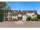 Exterior view of a well-maintained two-story apartment building with manicured landscaping at 5995 E Iliff-1 Ave # 309, Denver, CO 80222