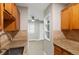 Galley-style kitchen with granite counters and stainless steel faucet at 5995 E Iliff-1 Ave # 309, Denver, CO 80222