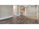 Spacious living room featuring light gray walls and vinyl plank flooring throughout at 5995 E Iliff-1 Ave # 309, Denver, CO 80222