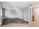 Living room with light walls, hardwood floors, and modern white shelving at 5995 E Iliff-1 Ave # 309, Denver, CO 80222