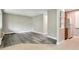 Living room with light gray walls, hardwood floors, and an adjacent kitchen at 5995 E Iliff-1 Ave # 309, Denver, CO 80222