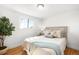 Serene bedroom with hardwood flooring, natural light, and cozy decor at 4210 S Dale Ct, Englewood, CO 80110