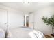 Bright bedroom with hardwood floors, white walls and trim, with a plant in the corner at 4210 S Dale Ct, Englewood, CO 80110
