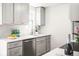 Close-up of a modern kitchen with stainless steel appliances and stylish fixtures at 4210 S Dale Ct, Englewood, CO 80110