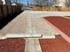 Backyard featuring red mulch beds and gravel, enclosed by a wooden fence at 805 Park Ave, Fort Lupton, CO 80621