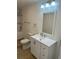 Bathroom features a single sink vanity, a toilet, and a shower and bath tub combination at 805 Park Ave, Fort Lupton, CO 80621