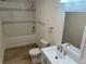 Bright bathroom showcasing modern fixtures, including a vanity, toilet, and tub-shower combo at 805 Park Ave, Fort Lupton, CO 80621