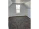 Cozy carpeted bedroom with natural light at 805 Park Ave, Fort Lupton, CO 80621