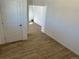 Neutral living room with wood look tile flooring at 805 Park Ave, Fort Lupton, CO 80621