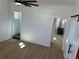 Bright living room features wood-look tile floors and opens to the kitchen at 805 Park Ave, Fort Lupton, CO 80621