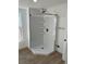Corner shower with a tile surround at 805 Park Ave, Fort Lupton, CO 80621