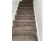 Carpeted stairs leading to the upper level at 805 Park Ave, Fort Lupton, CO 80621