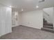 Spacious basement with neutral carpet, plenty of natural light and a staircase at 141 S Knox Ct, Denver, CO 80219