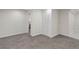 Spacious carpeted basement area with access to other rooms at 141 S Knox Ct, Denver, CO 80219