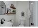 Charming bathroom with updated fixtures, stylish decor, and modern amenities at 141 S Knox Ct, Denver, CO 80219