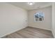 A simple bedroom with natural light and hardwood floors at 141 S Knox Ct, Denver, CO 80219