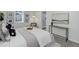 Comfortable bedroom showcasing stylish decor, neutral colors, and natural light at 141 S Knox Ct, Denver, CO 80219