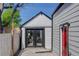 Charming house showcasing well-maintained siding, black trim, and modern doors at 141 S Knox Ct, Denver, CO 80219