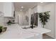 Updated kitchen featuring sleek countertops, stainless steel appliances, and modern fixtures at 141 S Knox Ct, Denver, CO 80219