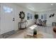 Open living space with a dining area, featuring a unique mirror and stylish decor at 141 S Knox Ct, Denver, CO 80219