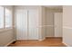 Empty bedroom features hardwood floor, and a double closet at 2140 Santa Fe Dr, Longmont, CO 80504