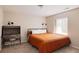 Bright bedroom with a large window, neutral walls, and black metal bed frame at 2140 Santa Fe Dr, Longmont, CO 80504