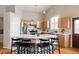 Bright kitchen features a center island with seating, stainless steel appliances, and wood cabinets at 2140 Santa Fe Dr, Longmont, CO 80504