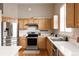 Well-equipped kitchen with modern appliances, ample counter space, and bright, natural wood cabinetry at 2140 Santa Fe Dr, Longmont, CO 80504
