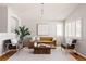 Stylish living room with a large window, comfortable seating, and a modern coffee table at 2140 Santa Fe Dr, Longmont, CO 80504