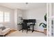 Cozy office space with natural light, hardwood floors, and a comfortable accent chair at 2140 Santa Fe Dr, Longmont, CO 80504