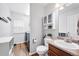 This bathroom offers a toilet, sink with vanity, and storage cabinet at 9272 Melborne Ct, Parker, CO 80134
