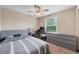 Comfortable bedroom with a ceiling fan, window, and grey dresser at 9272 Melborne Ct, Parker, CO 80134