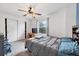 Bright bedroom with a window, closet, and ceiling fan at 9272 Melborne Ct, Parker, CO 80134
