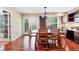 A formal dining room shows hardwood floors, neutral walls and a sliding glass door at 9272 Melborne Ct, Parker, CO 80134