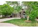 Well-maintained home with a two-car garage, green lawn and mature landscaping at 9272 Melborne Ct, Parker, CO 80134