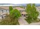 Charming home featuring a covered front porch and a well-maintained lawn, accented by mature trees and a lengthy driveway at 9272 Melborne Ct, Parker, CO 80134
