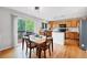 Eat-in kitchen with stainless steel appliances, wooden cabinets and a wooden deck at 9272 Melborne Ct, Parker, CO 80134