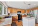 Bright kitchen with stainless steel appliances and a convenient center island at 9272 Melborne Ct, Parker, CO 80134