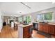 Eat-in kitchen flowing into living room, featuring stainless appliances and hardwood floors at 9272 Melborne Ct, Parker, CO 80134