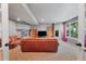 The finished basement features a gas fireplace, carpet, bookshelves, and a large window at 9272 Melborne Ct, Parker, CO 80134