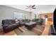 Open-concept living room with comfortable seating and ample space for entertaining at 9272 Melborne Ct, Parker, CO 80134