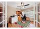 Bright office with a ceiling fan, ample workspace, and a view of the outdoors at 9272 Melborne Ct, Parker, CO 80134
