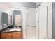 A renovated bathroom features a glass shower door, granite countertop and a modern vanity at 3952 S Carson St # 103, Aurora, CO 80014