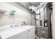 A utility room featuring a washing machine, dryer, water heater and a furnace at 3952 S Carson St # 103, Aurora, CO 80014
