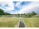 Scenic pond area featuring lush green space and a rock lined water feature at 3952 S Carson St # 103, Aurora, CO 80014