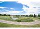 A well-maintained pond with a water feature is surrounded by a walking path at 3952 S Carson St # 103, Aurora, CO 80014