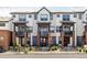 Attractive townhouse exterior showcasing multiple units, each with a small balcony and well-kept landscaping at 9490 W 14Th Ave # 3, Lakewood, CO 80215