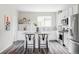 Contemporary kitchen featuring stainless steel appliances, white cabinets and a gray countertop island with seating at 9490 W 14Th Ave # 3, Lakewood, CO 80215